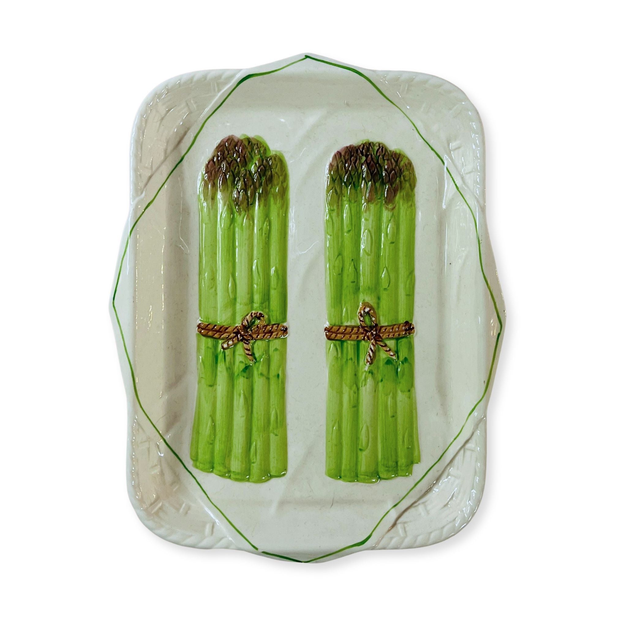 vintage ceramic plate with asparagus motifs at the center on a white background