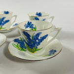Vintage English bone china cup, saucer, and dessert plate with bluebell floral pattern and gold rim