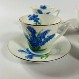 Vintage English bone china cup, saucer, and dessert plate with bluebell floral pattern and gold rim