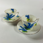 Vintage English bone china cup, saucer, and dessert plate with bluebell floral pattern and gold rim