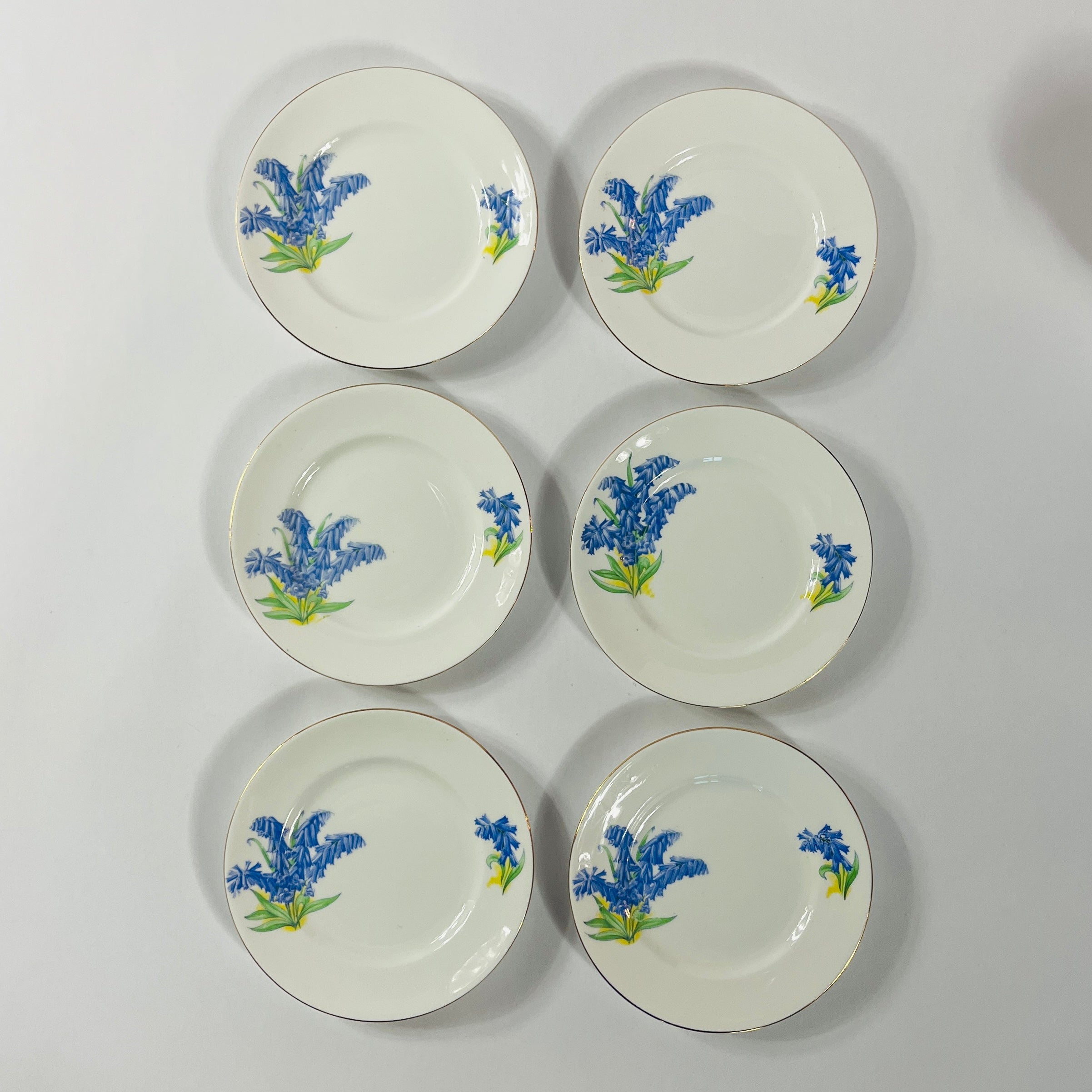 Set of six vintage English bone china dessert plates with bluebell floral pattern and gold rim