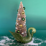 a green Vintage Ceramic Swan w/ Gold Christmas Tree Centerpiece against a green background. 