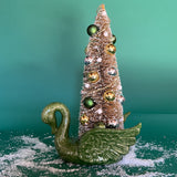 a green Vintage Ceramic Swan w/ Gold Christmas Tree Centerpiece against a green background. 