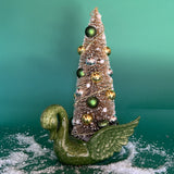 a green Vintage Ceramic Swan w/ Gold Christmas Tree Centerpiece against a green background. 