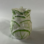 Vintage ceramic pitcher with sculpted leafy design and green hand-painted details