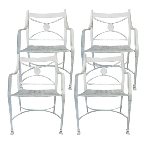 Four white vintage metal patio chairs