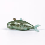 Decorative whale glass christmas ornaments on a white background