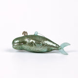 Decorative whale glass christmas ornaments on a white background
