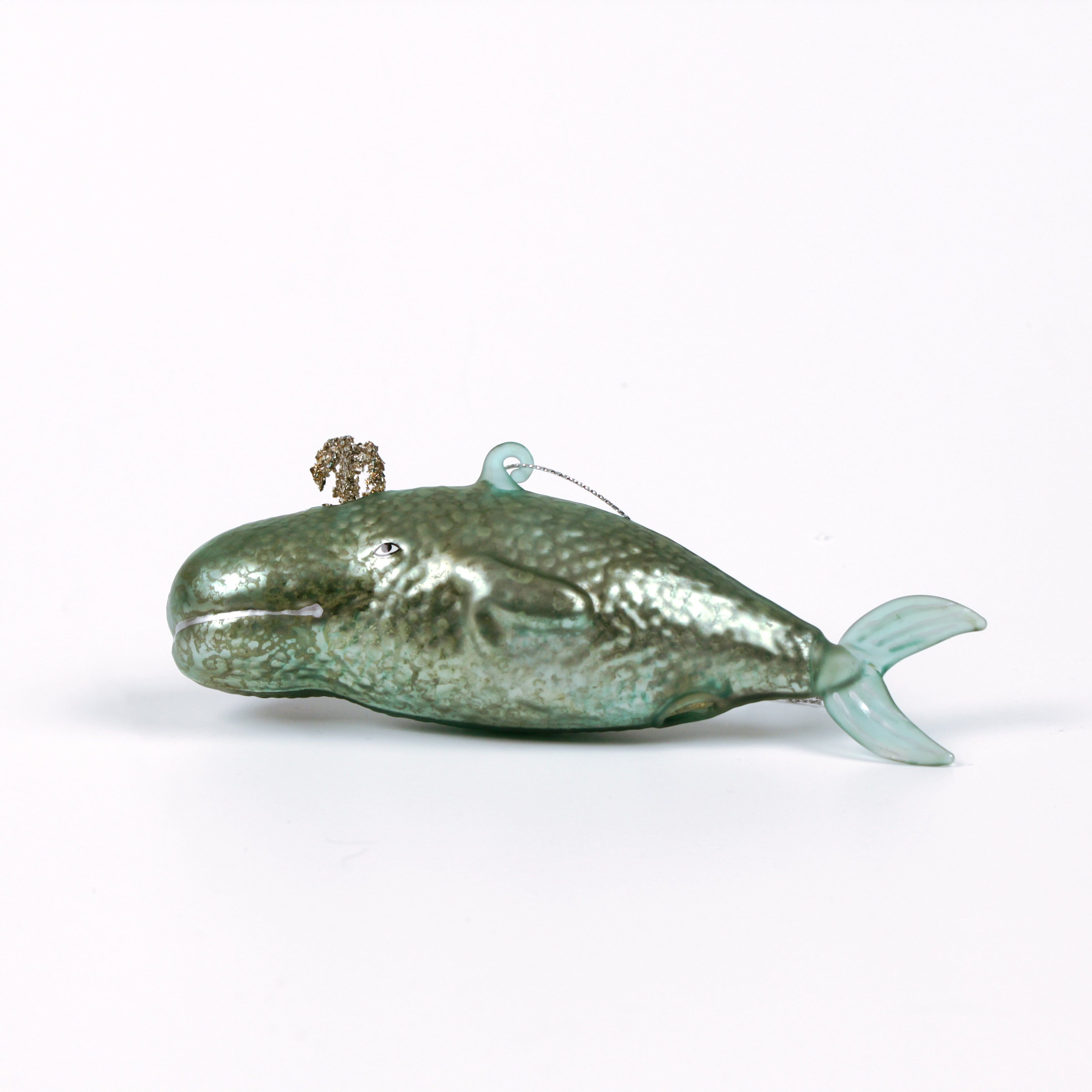 Decorative whale glass christmas ornaments on a white background