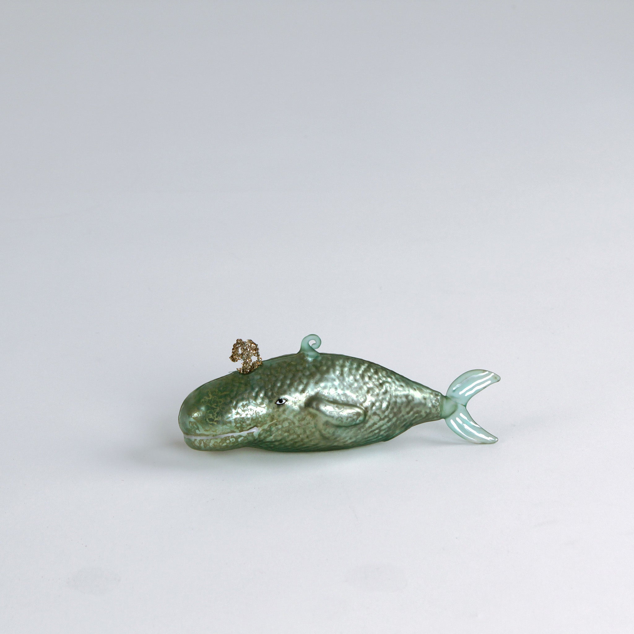 Decorative whale glass christmas ornaments on a white background