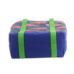 bottom of the large Whale of a Time canvas tote bags with lime straps and blue fabric with a repeating pink whale  and green star motif.