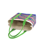 a Whale of a Time canvas tote bags with lime straps and blue fabric with a repeating pink whale  and green star motif.