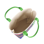 this image shows the inside of a large Whale of a Time canvas tote bags with lime straps and blue fabric with a repeating pink whale  and green star motif.