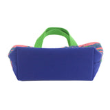 this image shows the bottom of a small  Whale of a Time canvas tote bags with lime straps and blue fabric with a repeating pink whale  and green star motif.