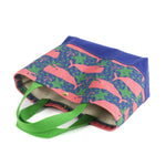 small Whale of a Time canvas tote bags with lime straps and blue fabric with a repeating pink whale  and green star motif.