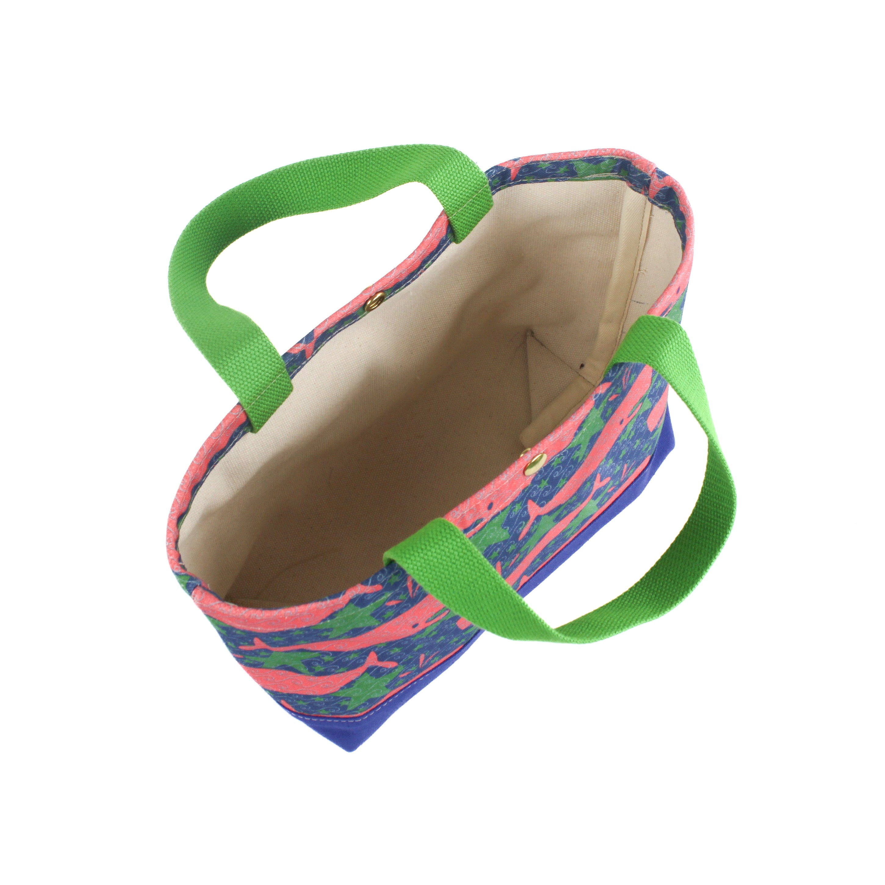 the image shows the inside of a small Whale of a Time canvas tote bags with lime straps and blue fabric with a repeating pink whale  and green star motif.