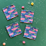 Whale of a Time cloth cocktail napkins on a green background with candies.