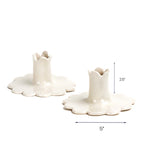 White scalloped candle holder with dimension of 5" x 2.5".