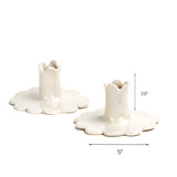 White scalloped candle holder with dimension of 5" x 2.5".