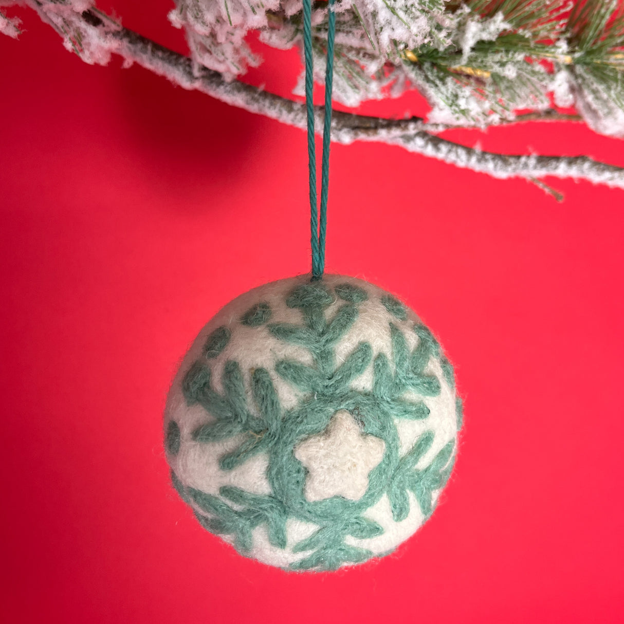 White and green felt christmas snowflake ornament