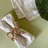 light green and white dinner napkin with monkey dinner napkin ring