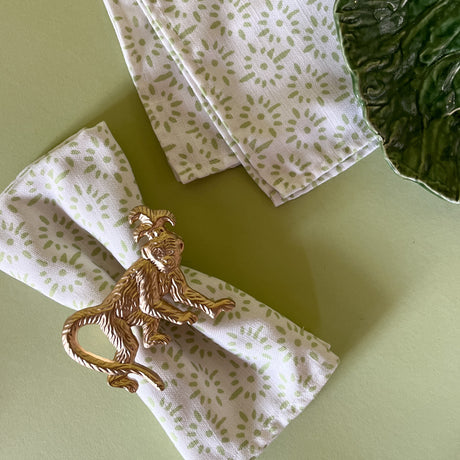light green and white dinner napkin with monkey dinner napkin ring