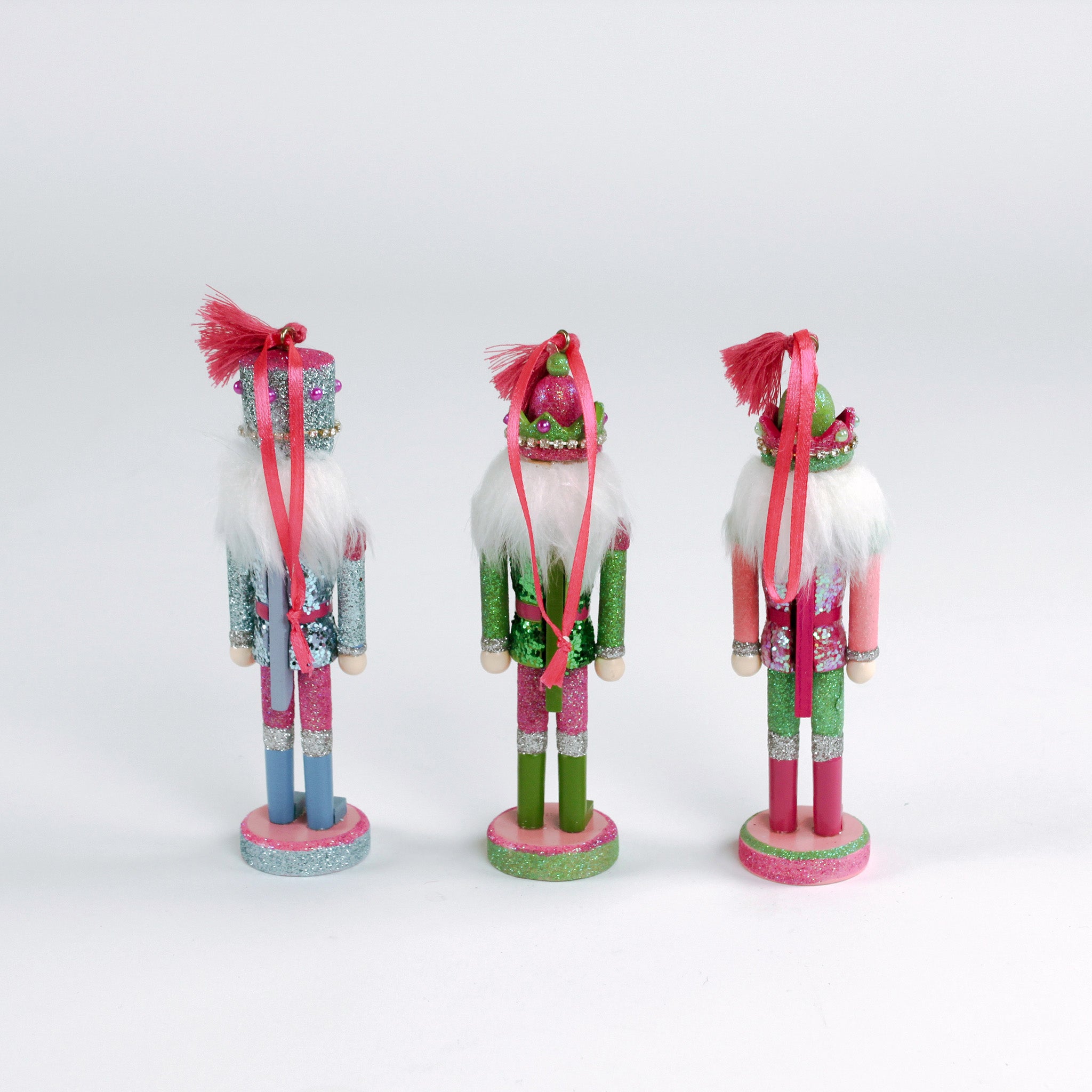 back of a set of three Wood Glitter Nutcracker Christmas Ornaments
