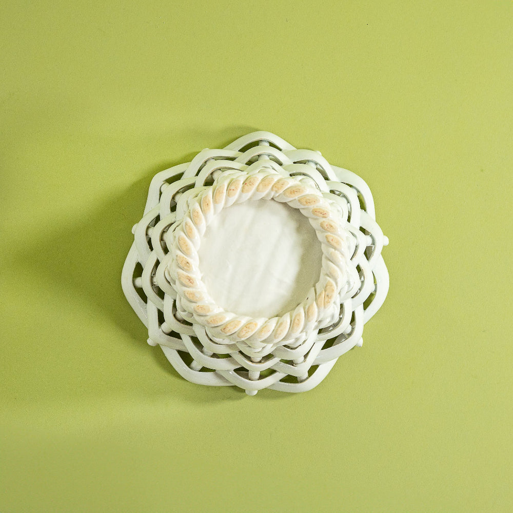 a white vintage italian ceramic basket