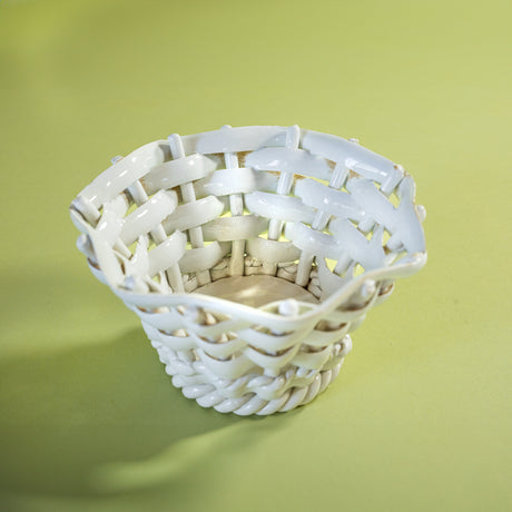 a white vintage italian ceramic basket