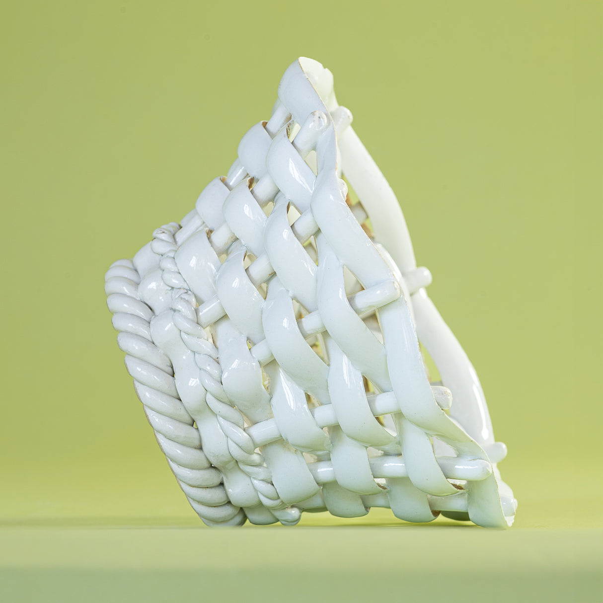 a white vintage italian ceramic basket