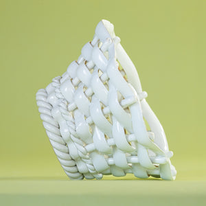 a white vintage italian ceramic basket