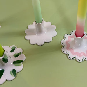 A trio of Madcap Cottage ceramic candleholders with scalloped edges