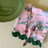 temple garden pink and green chinoiserie dinner napkin with plate and silverware