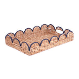 a rattan scalloped tray with navy blue trim