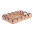 a rattan scalloped tray with navy blue trim