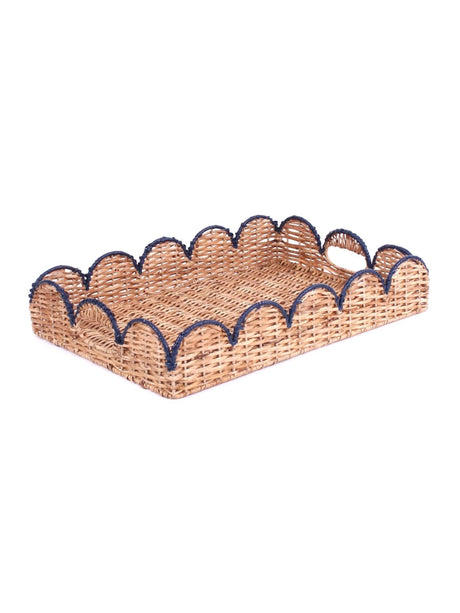 a rattan scalloped tray with navy blue trim