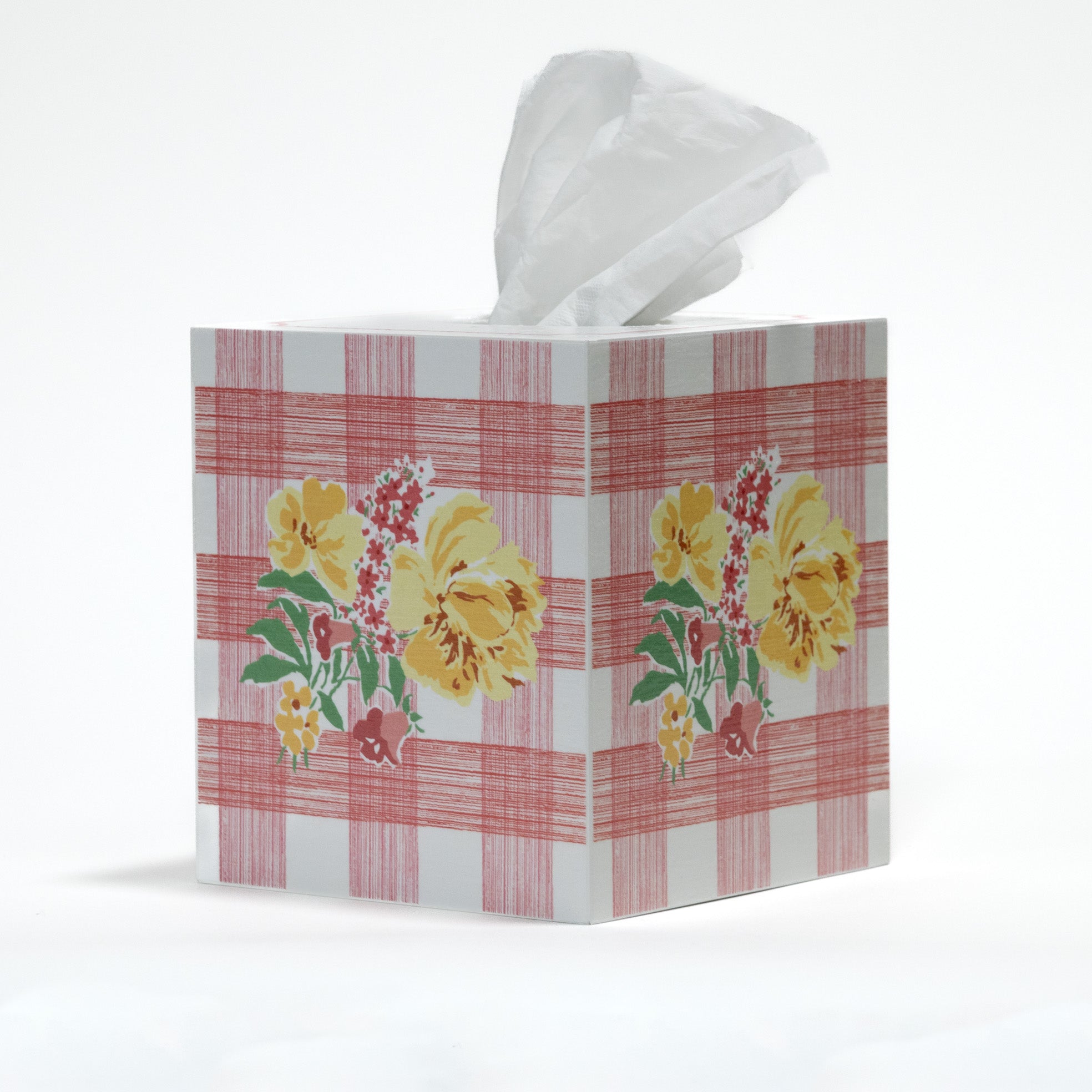a pink gingham tissue box cover with a central floral motif on each side.