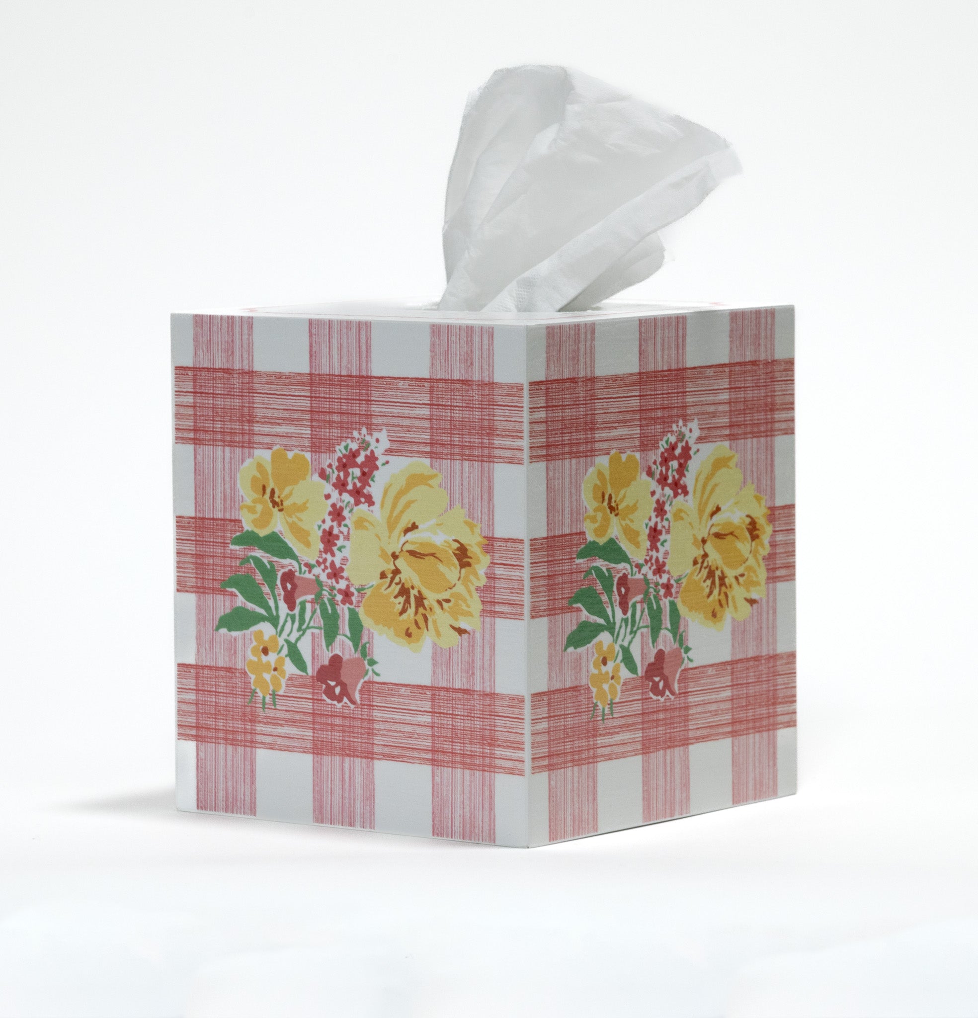 a pink gingham tissue box cover with a central floral motif on each side.