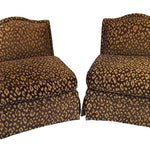 a pair of vintage leopard print chairs