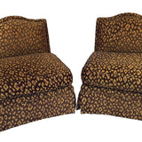 a pair of vintage leopard print chairs