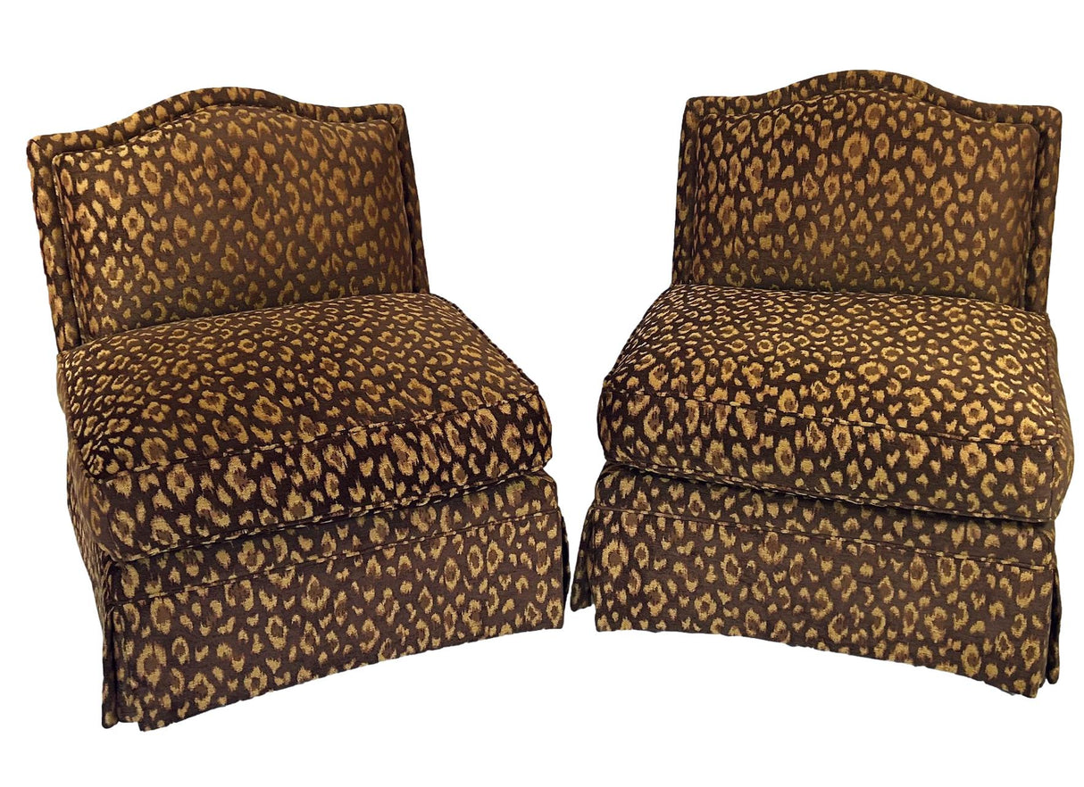 a pair of vintage leopard print chairs