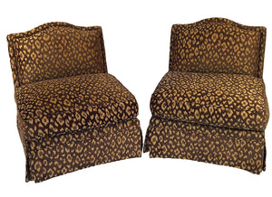 a pair of vintage leopard print chairs