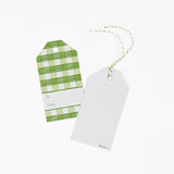 A green gingham patterned gift tags with a white space for personalized message with 1 showing the back