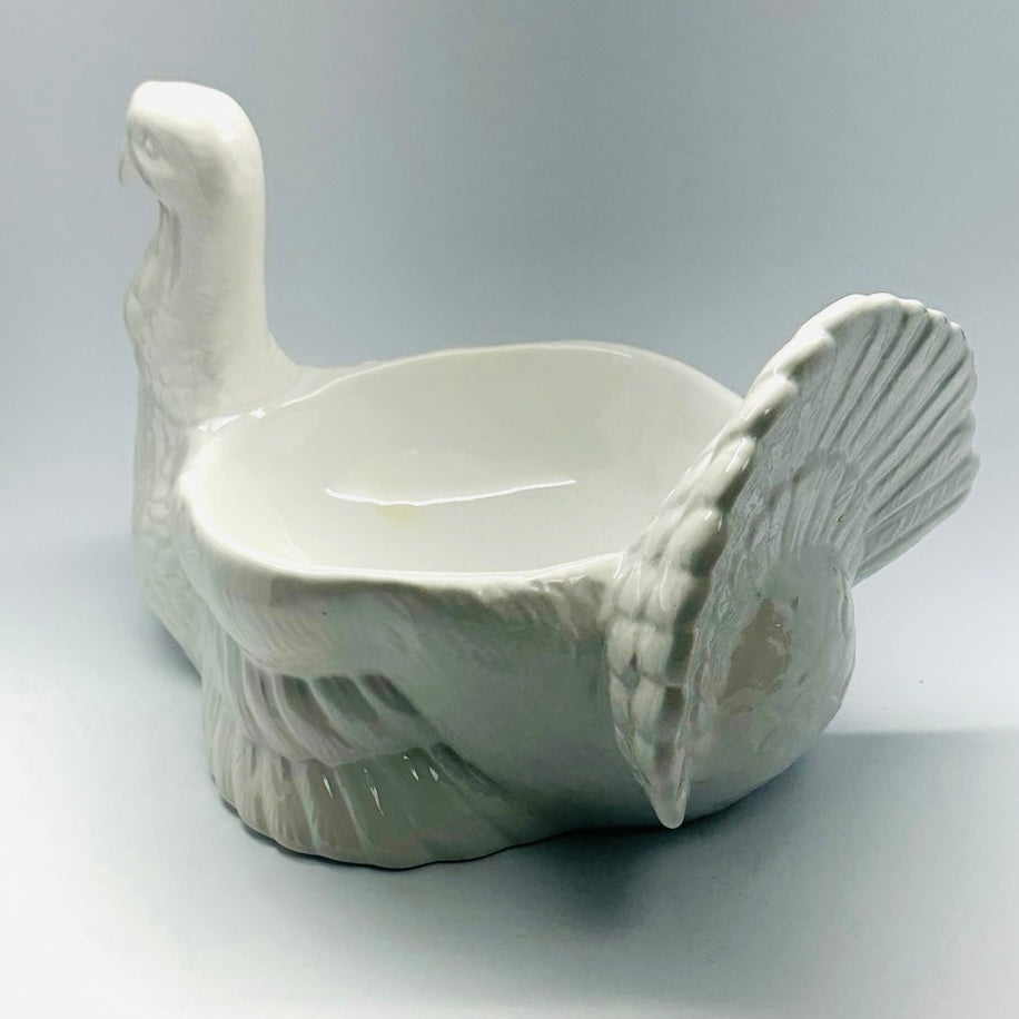 the back view of a white ceramic turkey centerpiece
