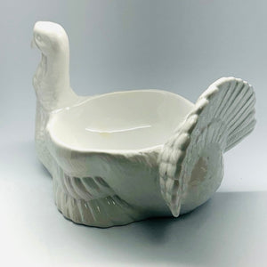 the back view of a white ceramic turkey centerpiece