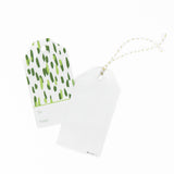 A green gift tag with a geometric pattern, 1 showing the back displayed on a white background