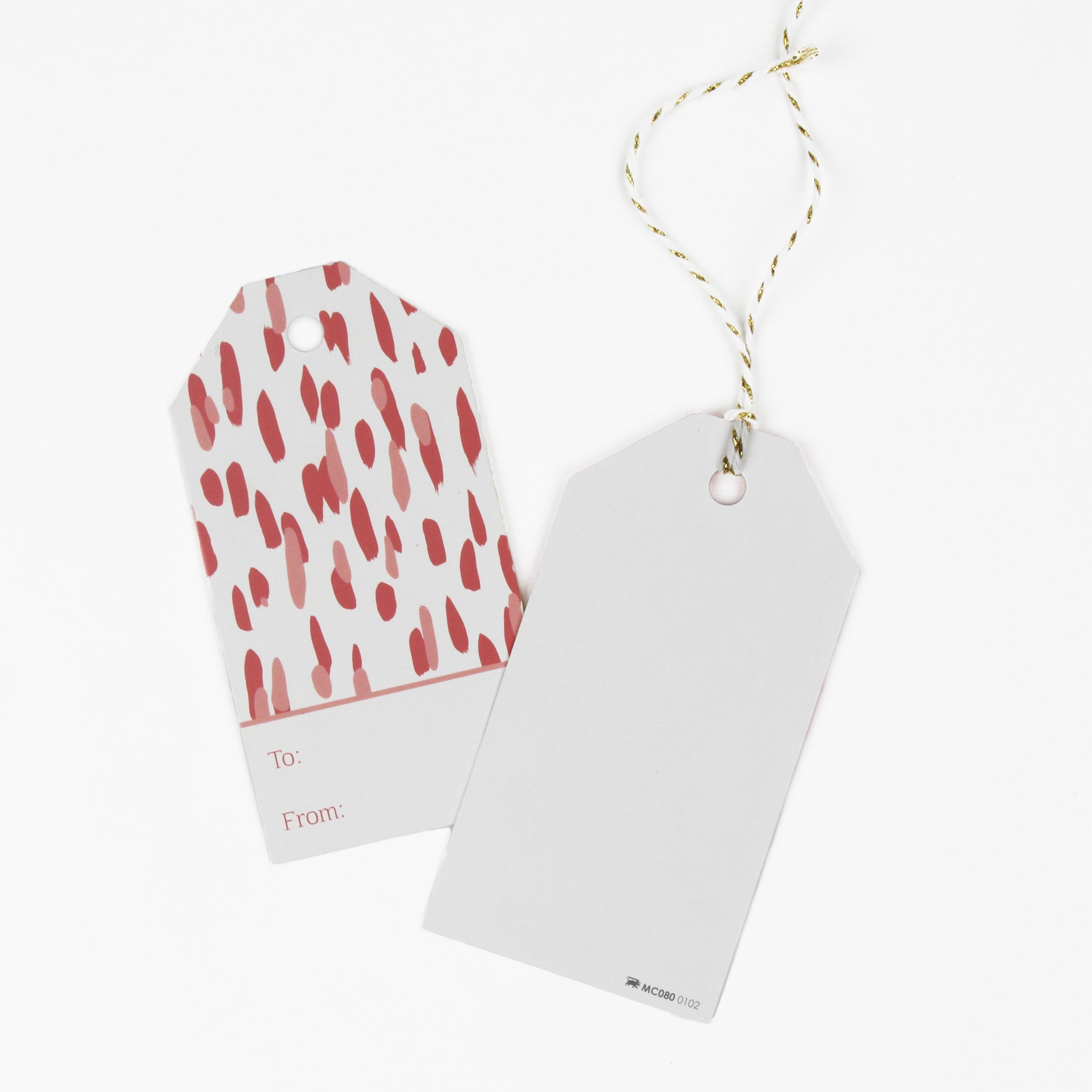 A pink gift tag with a geometric pattern, 1 showing the back displayed on a white background