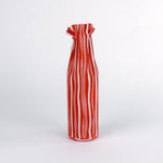 madcap cottage Red and white striped wine bottle bag with a label on a white background