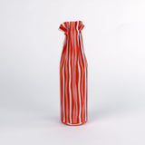 madcap cottage Red and white striped wine bottle bag with a label on a white background