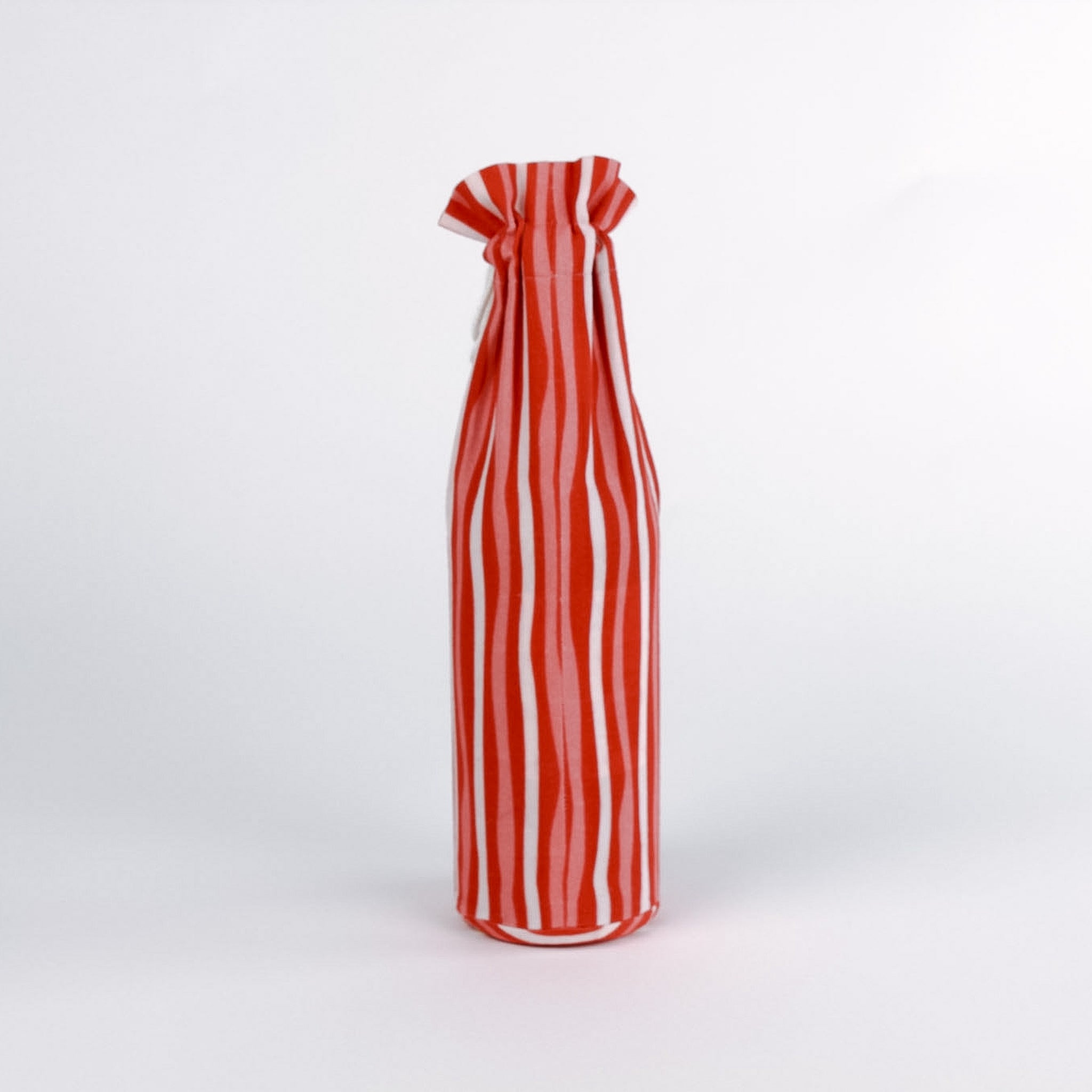 madcap cottage Red and white striped wine bottle bag with a label on a white background